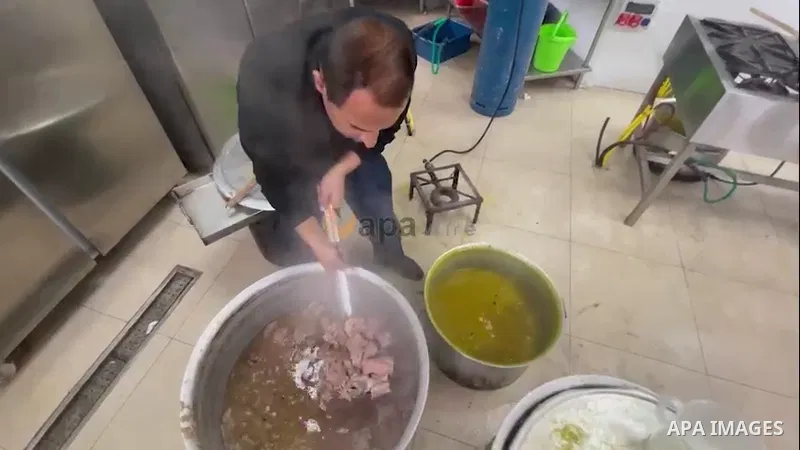 Palestinian volunteers cook free food for Poor families during the Muslim fasting month of Ramadan, at Tkiyet Aida in the Aida refugee camp in the West Bank city of Bethlehem. 0.1
