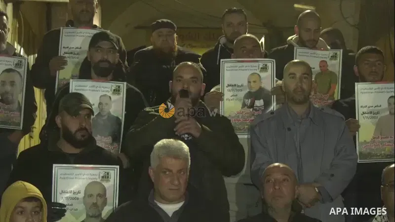Palestinians take part in a protest in solidarity with prisoners in Israeli jails, in the West Bank city of Jenin. 0.1