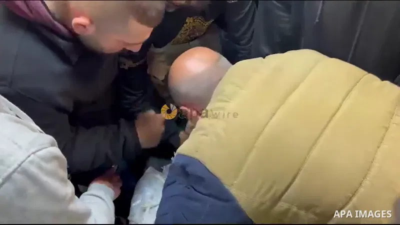 Palestinians mourn over the body of Mohammed Al-Junaidi, who was shot killed by Israeli forces during a raid, in the West Bank city of Nablus.