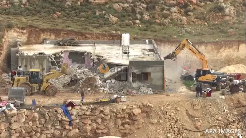 Israeli bulldozers demolish a Palestinian owned house, built without a permit from the Israeli authorities in the area C which lies under their control since 1967, in the West Bank village of Duma. 0.1