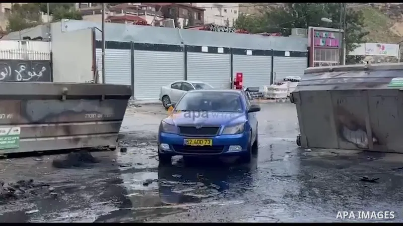 Waste and stones lie on a blocked street during a strike against house demolitions by Israeli authorities, in the east Jerusalem neighbourhood of Jabal Mukaber.