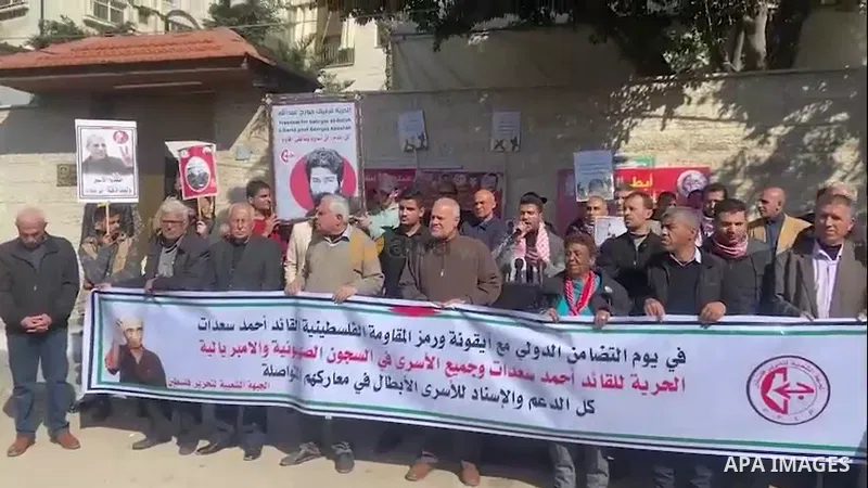 Palestinians take part in a protest in support prisoners in Israeli jails, in front of Red Cross office in Gaza city