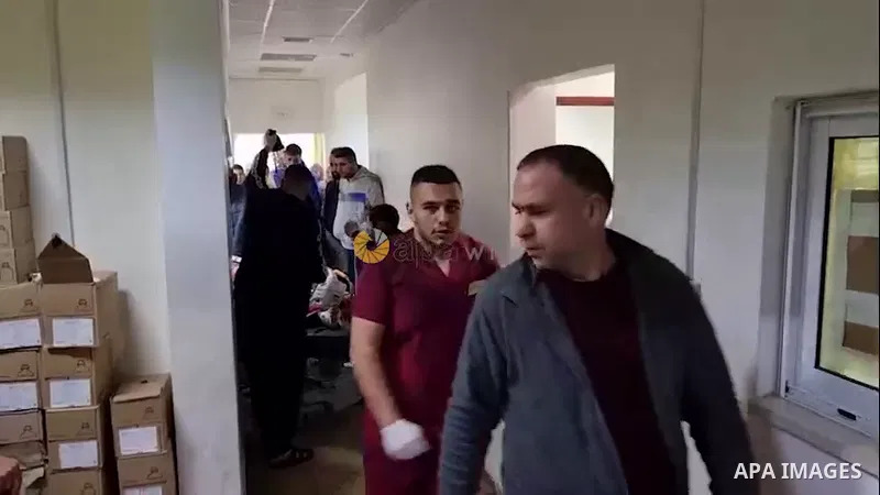 Palestinians push a bed where the body of Habib Kamil, who was shot killed by Israeli forces lie at a hospital, in the West Bank city of Jenin.