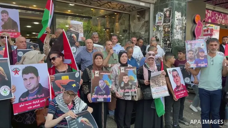Palestinians participate in a demonstration denouncing the Israeli occupation massacres in Gaza, especially the recent Nuseirat massacre, in front of Martyrs’ Square in the center of the city of Nablus in the West Bank.