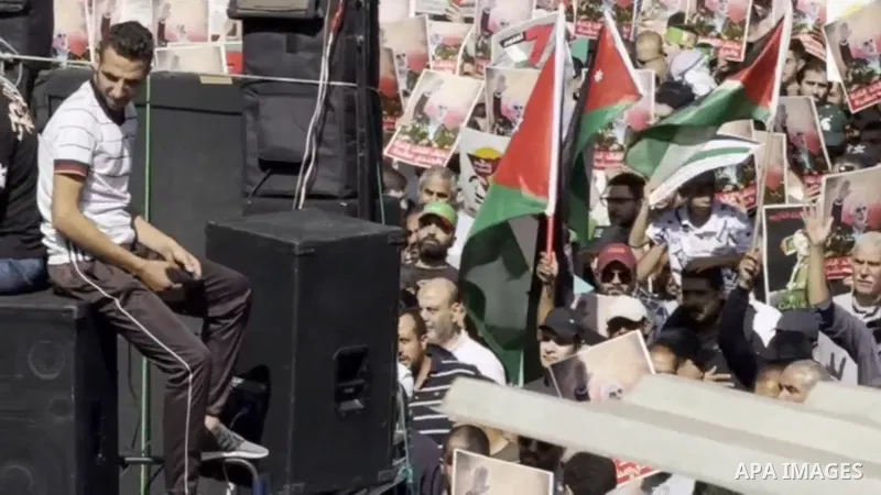 People, holding banners and Palestinian flags, gather to protest against Israeli attacks on Gaza and assassination of Hamas' Political Bureau Head Yahya Sinwar in Amman, Jordan.