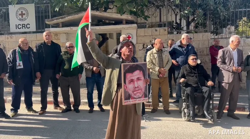 Palestinians take part in a mass rally in Tulkarm city in support of Gaza and prisoners in occupation prisons coinciding with the International Day of Solidarity with the Palestinian People in Tulkarm in the West Bank. 0...
