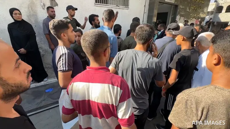 Restrictions Summary: APA wire clients only Shortlist: APAwire - APA wire clients only, Gaza- July 9, 2025. Relatives of Palestinians killed in an Israeli airstrike mourn at the morgue of Al-Shifa Hospital in Gaza City,...