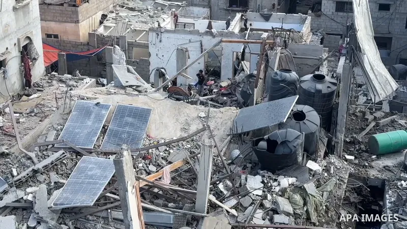 Restrictions Summary: APA wire clients only Shortlist: APAwire - APA wire clients only, Gaza- July 4, 2025. A view of the site of Thursday's Israeli strike that damaged and destroyed residential buildings, at Shati (Beac...