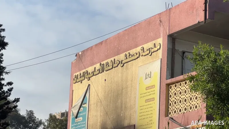 Restrictions Summary: APA wire clients only Shortlist: APAwire - APA wire clients only, Gaza- July 3, 2025. A view of damage at Mustafa Hafez School and the tents around it following the Israeli attacks in Gaza City, Gaz...