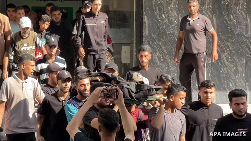 Restrictions Summary: APA wire clients only Shortlist: APAwire - APA wire clients only, Gaza- July 3, 2025. Bodies of Palestinians, who lost their life following the attack on the al-Awda Hospital at Nuseirat Refugee Cam...