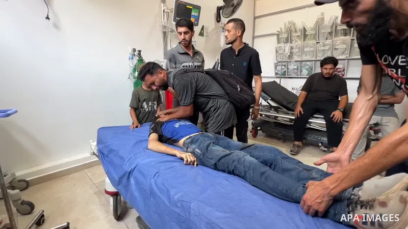 Restrictions Summary: APA wire clients only Shortlist: APAwire - APA wire clients only, Nuseirat- July 2, 2025. Palestinians transport the body of a child who lost his life to Al-Awda Hospital in Nuseirat Camp, after Isr...