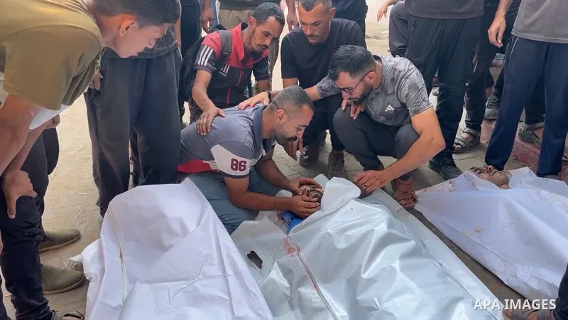 Restrictions Summary: APA wire clients only Shortlist: APAwire - APA wire clients only, Gaza City- July 1, 2025. Relatives of Palestinians who lost their lives include children mourn in Al-Shifa Hospital after an Israeli...