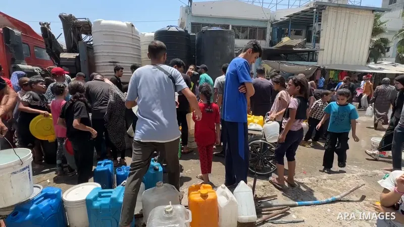 Restrictions Summary: APA wire clients only Shortlist: APAwire - APA wire clients only, Gaza- July 2, 2025. Palestinians try to meet their daily water needs by filling jerry cans from water tankers brought into the area...
