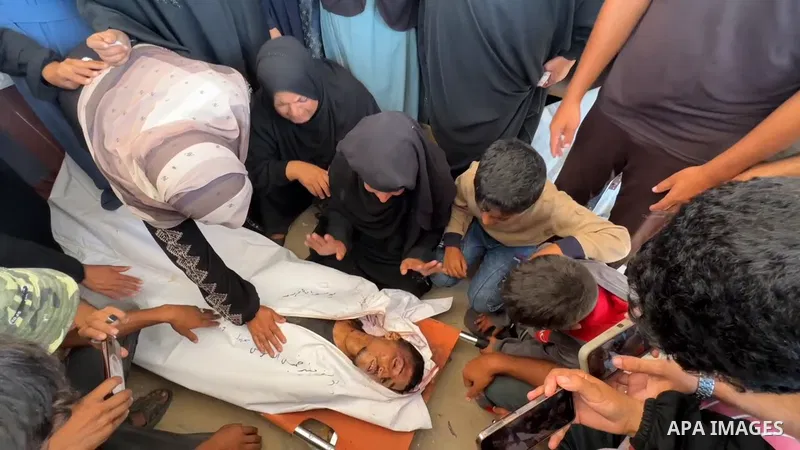 Restrictions Summary: APA wire clients only Shortlist: APAwire - APA wire clients only, Khan Yunis- July 2, 2025. Mourners react during the funeral of Palestinians, who, according to Gaza's health ministry, were killed i...