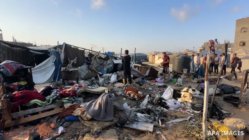 Restrictions Summary: APA wire clients only Shortlist: APAwire - APA wire clients only, Khan Yunis- July 2, 2025. Palestinians inspect the damage at the site of an overnight Israeli air strike on a tent sheltering displa...
