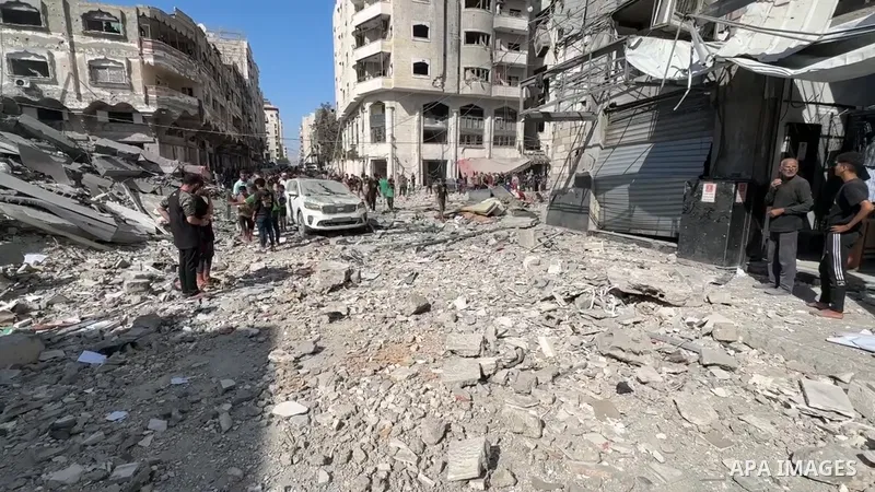 Restrictions Summary: APA wire clients only Shortlist: APAwire - APA wire clients only, Gaza City- June 27, 2025. Palestinians inspect the site of an Israeli air strike on a house in Gaza City, June 27, 2025.