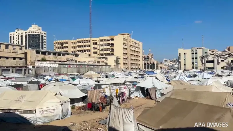Restrictions Summary: APA wire clients only Shortlist: APAwire - APA wire clients only, Gaza City- May 28, 2025. Palestinian gymnast Ahmed Al-Ghalban, 16, is receiving care from his family in a tent set up amid the ruins...