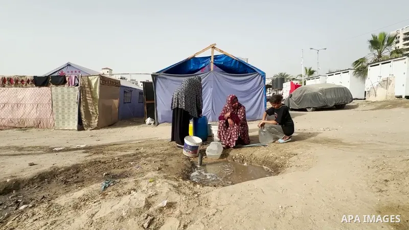 Restrictions Summary: APA wire clients only Shortlist: APAwire - APA wire clients only, Gaza- May 15, 2025. Palestinians women are living in harsh conditions in tents, facing challenges in accessing basic necessities suc...