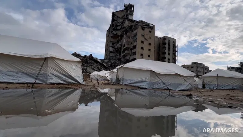 Tents sheltering displaced Palestinians are erected in the yards of destroyed schools and buildings in the north of Gaza City on February 11, 2025 amid the current ceasefire deal in the war between Israel and Hamas.