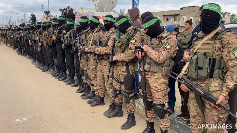 Or Levy, Eli Sharabi and Ohad Ben Ami, hostages held in Gaza since the October 7, 2023 attack, are released by Hamas militants as part of a ceasefire and a hostages-prisoners swap deal between Hamas and Israel in Deir Al...