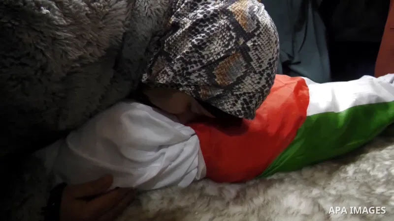 Palestinians mourn the body of the child Laila Muhammad Ayman al-Khatib, 3, who succumbed to critical wounds she sustained from Israeli occupation forces' bullets to the head in the Martyrs' Triangle area in Jenin in the...