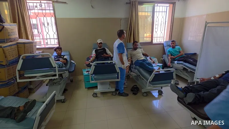 Palestinians donate blood during a campaign organized by the Palestinian Ministry of Health and Nasser Medical Complex to support blood banks facing severe shortages amid the ongoing war.