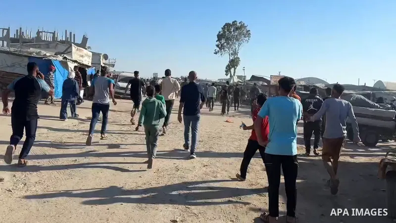 Restrictions Summary: APA wire clients only Shortlist: APAwire - APA wire clients only, Khan Yunis- Gaza Strip- June 20, 2026. Palestinians gather at the site of an Israeli airstrike that targeted displacement tents in t...