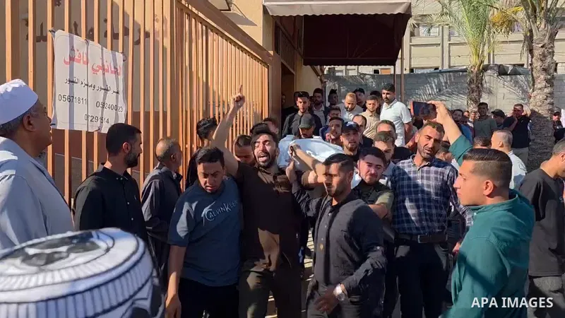 Restrictions Summary: APA wire clients only Shortlist: APAwire - APA wire clients only, Khan Younis- June 18, 2026. Mourners bid farewell to the bodies of Hussein al-Qidra and Mohammed Abdel Jawad al-Farra during their f...
