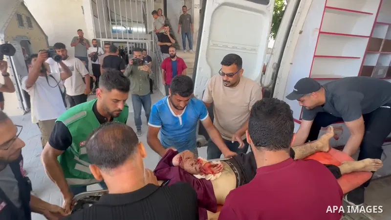 Restrictions Summary: APA wire clients only Shortlist: APAwire - APA wire clients only, Gaza- June 15, 2026. Palestinians bid farewell to the bodies of nurse Mohammed al-Hbeil and his child at al-Shifa Hospital in Gaza C...