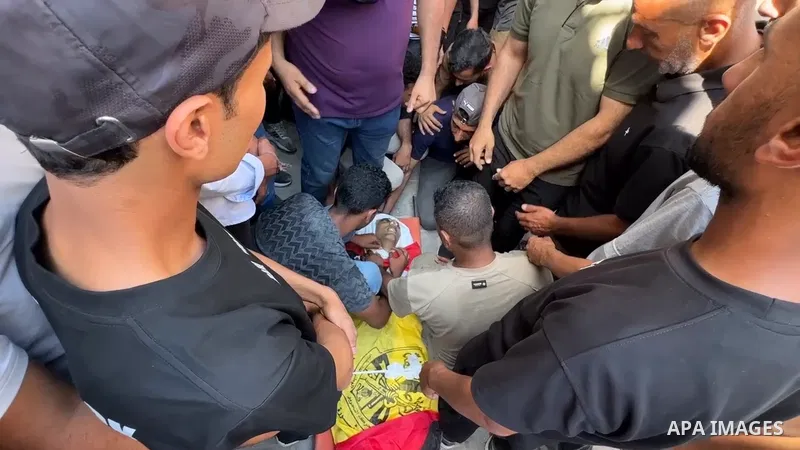 Restrictions Summary: APA wire clients only Shortlist: APAwire - APA wire clients only, Gaza- June 15, 2026. Palestinians bid farewell to the body of Khalil al-Masri at al-Shifa Hospital in Gaza City on June 15, 2026, af...