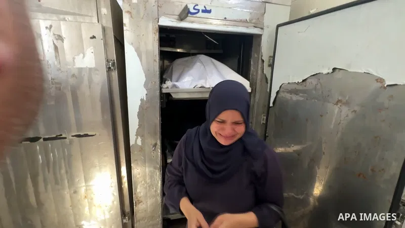 Restrictions Summary: APA wire clients only Shortlist: APAwire - APA wire clients only, Deir al-Balah- June 15, 2026. Palestinians bid farewell to the bodies of a woman and a child at Al-Aqsa Martyrs Hospital in Deir al-...