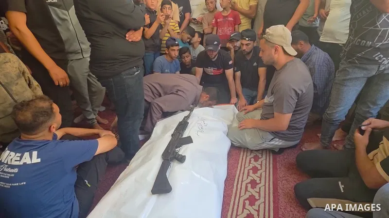 Restrictions Summary: APA wire clients only Shortlist: APAwire - APA wire clients only, Khan Younis- June 14, 2026. Mourners carry and bid farewell to the bodies of Husam al-Jabri and Mohammed al-Namroti during their fun...