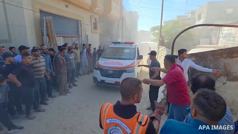Restrictions Summary: APA wire clients only Shortlist: APAwire - APA wire clients only, Khan Younis- June 14, 2026. Medics evacuate wounded Palestinians from the site of an Israeli airstrike that targeted a tent shelteri...