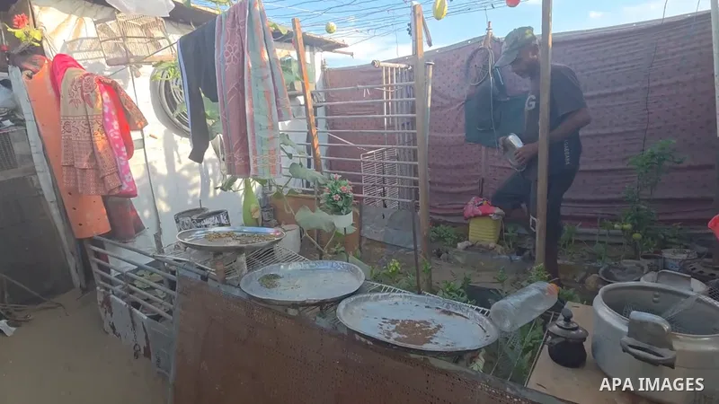 Restrictions Summary: APA wire clients only Shortlist: APAwire - APA wire clients only, Khan Younis- June 13, 2026. Displaced Palestinian Tamer Abu Marouf tends to vegetable crops and plants he cultivated in a small plot...