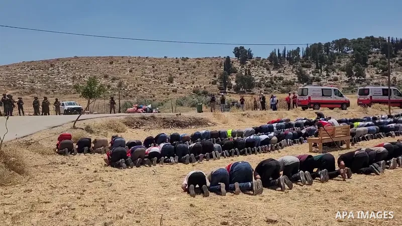 Restrictions Summary: APA wire clients only Shortlist: APAwire - APA wire clients only, Hebron- June 12, 2026. Israeli security forces stand guard as Palestinian men, who had gathered to protest threats of confiscation o...