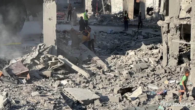 Restrictions Summary: APA wire clients only Shortlist: APAwire - APA wire clients only, al-Maghazi- June 11, 2026. Palestinians clear the rubble of a building that was destroyed in an Israeli airstrike, at al-Maghazi ref...