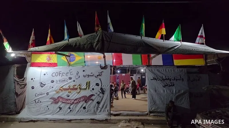 Restrictions Summary: APA wire clients only Shortlist: APAwire - APA wire clients only, Khan yunis- June 11, 2026. Displaced Palestinians watch the opening ceremony of the FIFA World Cup at a café in the al-Mawasi area o...