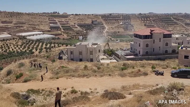 Restrictions Summary: APA wire clients only Shortlist: APAwire - APA wire clients only, Hebron - June 8, 2026. Israeli bulldozers demolish the two-story home of Palestinian resident Nayef Abu Sneineh and a carpentry work...