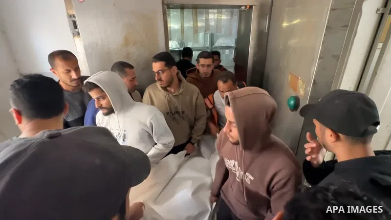 Restrictions Summary: APA wire clients only Shortlist: APAwire - APA wire clients only, Gaza- April 26, 2026. Palestinians hold a funeral procession for two citizens at al-Shifa Hospital in Gaza City, after they were kil...