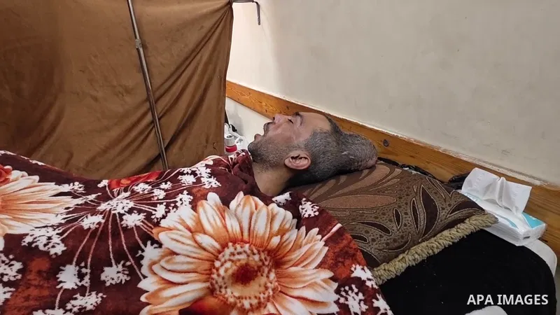 Restrictions Summary: APA wire clients only Shortlist: APAwire - APA wire clients only, Khan Yunis - April 13, 2026. The wounded Raed Al-Muraidi lies on a treatment bed in Nasser Hospital in Khan Yunis, after being injur...