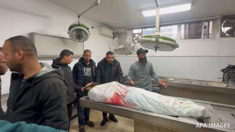 Restrictions Summary: APA wire clients only Shortlist: APAwire - APA wire clients only, Gaza- March 28, 2026. Palestinians bid farewell to the bodies of brothers Saed and Fahmi Qaddoum, who were killed in an Israeli dron...