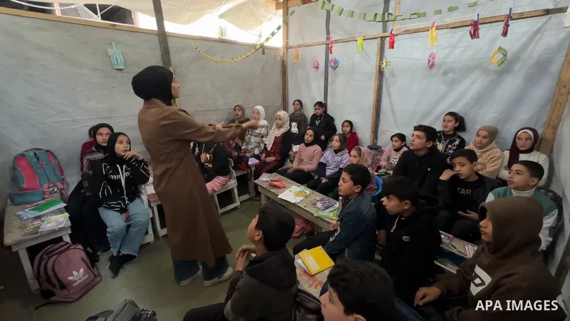 Restrictions Summary: APA wire clients only Shortlist: APAwire - APA wire clients only, Gaza City- March 4, 2026. Displaced Palestinian children receive lessons inside a tent in a camp for displaced people in the Yarmouk...