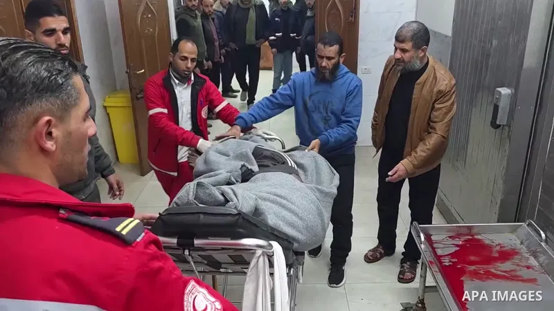 Restrictions Summary: APA wire clients only Shortlist: APAwire - APA wire clients only, Gaza- January 12, 2026. Palestinians participate in the funeral procession for four bodies at Nasser Hospital in Khan Younis. Three...