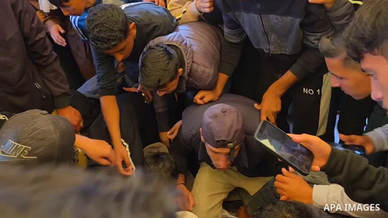 Restrictions Summary: APA wire clients only Shortlist: APAwire - APA wire clients only, Khan Yunis- January 10, 2026. Palestinians mourn the body of a man at Nasser Medical Complex in Khan Younis after he was brought to...